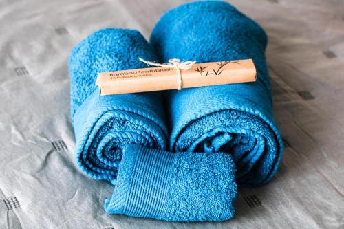 a blue towel with a book on top of it at Casa Lara Fuerteventura in Corralejo