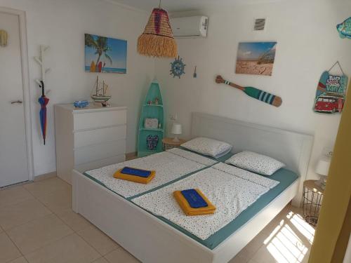 a bedroom with a bed with a surfboard on it at Villa Panoramica / La Nucia (Costa Blanca) in La Nucía