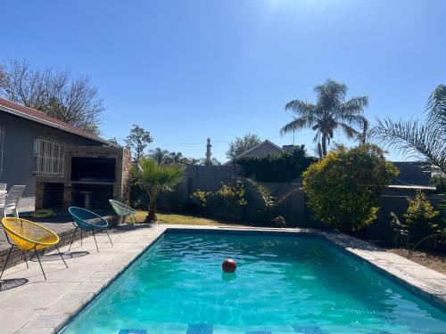 a pool with a ball in the middle of a yard at Vic's place - With backup power in Sandton