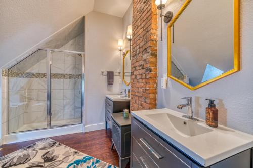 a bathroom with a sink and a shower at Walk to Dtwn Colorful Cañon City Home with Grill! in Canon City