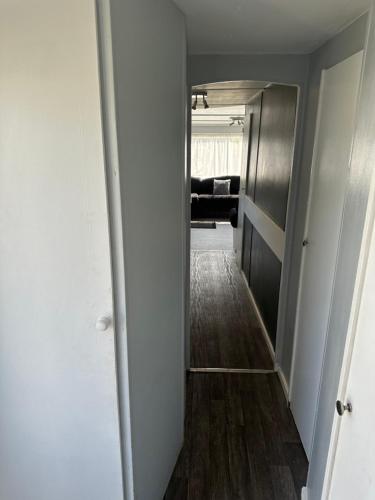 a hallway leading to a living room with a hallway at Colemans Caravans 3 Bedroom 6 Birth Caravan Golden Anchor Caravan Park in Chapel Saint Leonards