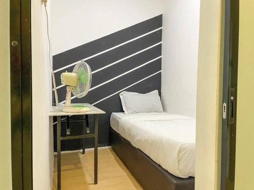 Katil atau katil-katil dalam bilik di Hush Inn at ITCC Manhattan Suites