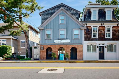 a blue house on a street in front of a house at Town of Lewes --- 119 Front St. in Lewes