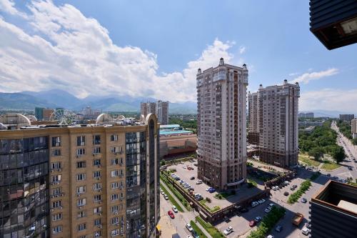 an aerial view of a city with tall buildings at Five Business-class rooms in R-house near Mega Center Almaty in Almaty