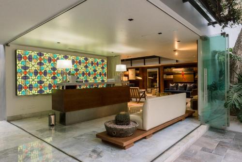 a lobby of a house with a tile wall at Hotel Matilda, a Member of Design Hotels in San Miguel de Allende