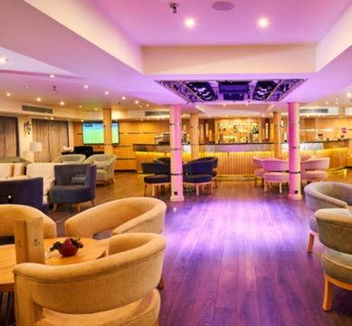 a restaurant with chairs and tables and a bar at Royal Cruise Aswan to Luxor 3 Night And visit the Nubian village in Luxor