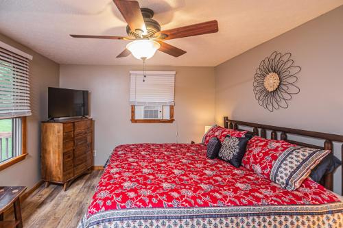a bedroom with a bed and a ceiling fan at Laurel Ridge in McHenry