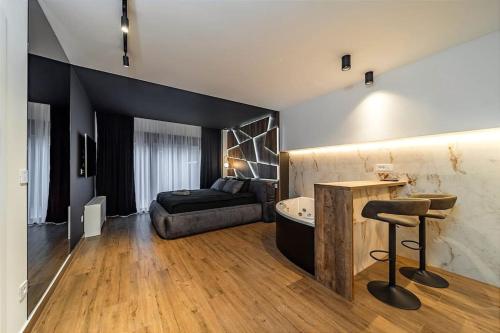 a bathroom with a bed and a tub in a room at Dark Nest 1 Belgrade Apartments in Zvezdara
