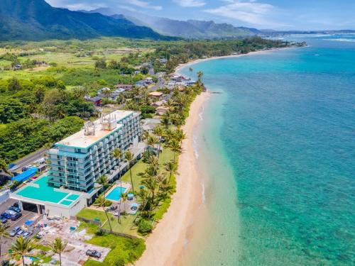 an aerial view of the beach and the ocean at Luxury Beachfront Condo in Hauula