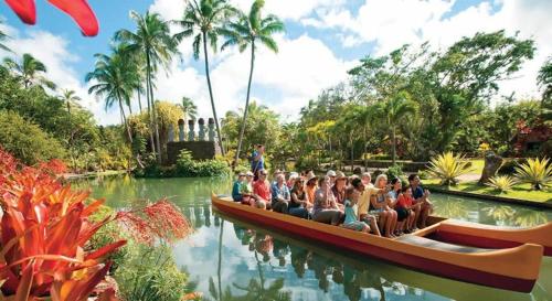 a group of people riding on a boat in the water at Luxury Beachfront Condo in Hauula