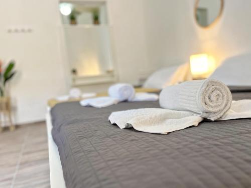 two beds with towels on top of them at Maria & Matthias - Apartments in Central of Floriana in Il-Furjana