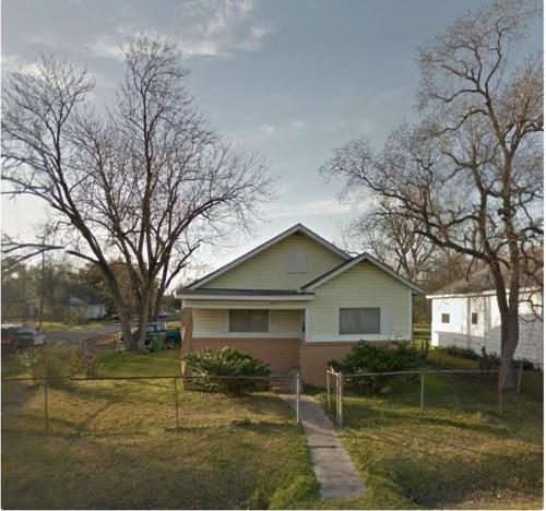 a house in a yard with trees and a driveway at 3 Bedroom Retreat with Modern Comforts and Local Charm in Port Arthur