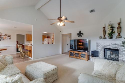 a living room with a couch and a tv at Relax In Your Private Paradise in Ocean Springs