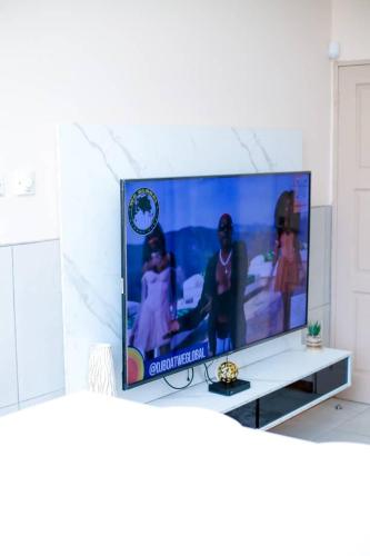 a flat screen tv sitting on top of a table at JTown CBD Self-Catering Apartment in Jwaneng