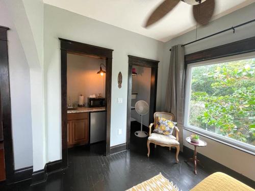 a living room with a chair and a window at Heavenly Suite in Little Havana Free Parking in Miami