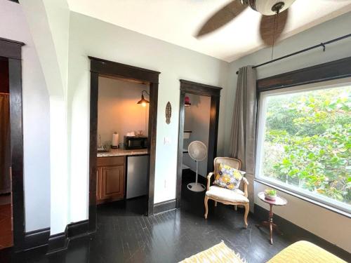a living room with a chair and a window at Heavenly Suite in Little Havana Free Parking in Miami
