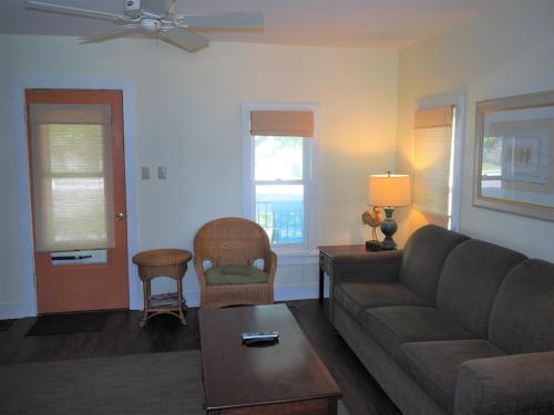 a living room with a couch and a chair at The Cute & Cozy - Lower Apt - Great Location! in Frankfort