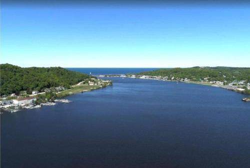 an aerial view of a large river with boats in it at Sunset Bay - Lakefront, Large, And Gorgeous! in Frankfort