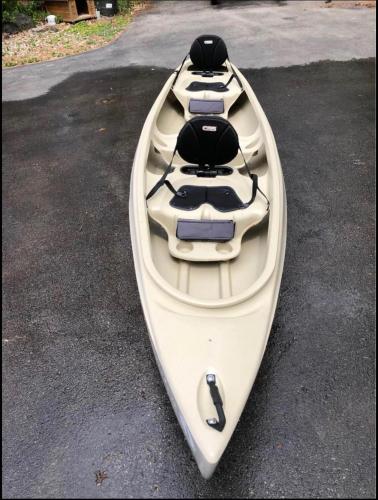 a white kayak sitting on top of a road at Sunset Bay - Lakefront, Large, And Gorgeous! in Frankfort