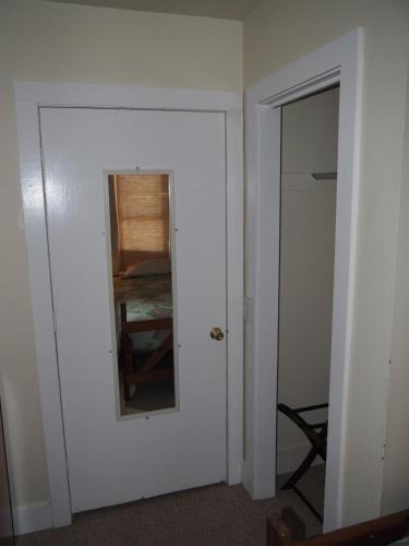 a room with a door with a mirror and a room at The Cute & Cozy - Lower Apt - Great Location! in Frankfort