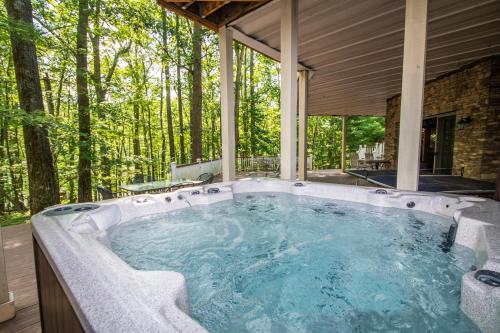 a jacuzzi tub in a house in the woods at Lake Dreaming in McHenry