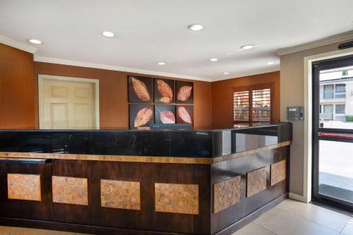 a bar in a restaurant with a counter at Best Western Inn in Merced
