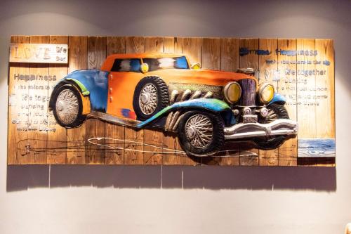 a painting of a truck hanging on a wall at Best Western La Vista Pathankot in Pathānkot