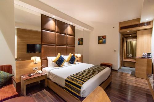 Ένα ή περισσότερα κρεβάτια σε δωμάτιο στο Best Western La Vista Pathankot