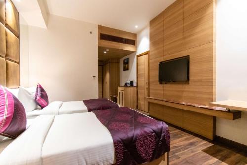 Μια τηλεόραση ή/και κέντρο ψυχαγωγίας στο Best Western La Vista Pathankot