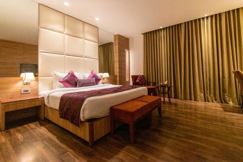 Ένα ή περισσότερα κρεβάτια σε δωμάτιο στο Best Western La Vista Pathankot