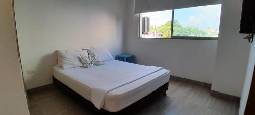 Postel nebo postele na pokoji v ubytování Tolú mágico, apartamentos amoblados con vista al mar, Elegancia y comodidad