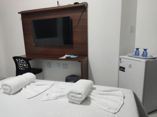 Ένα ή περισσότερα κρεβάτια σε δωμάτιο στο Da Silva residência à 200 metros da praia do Bessa