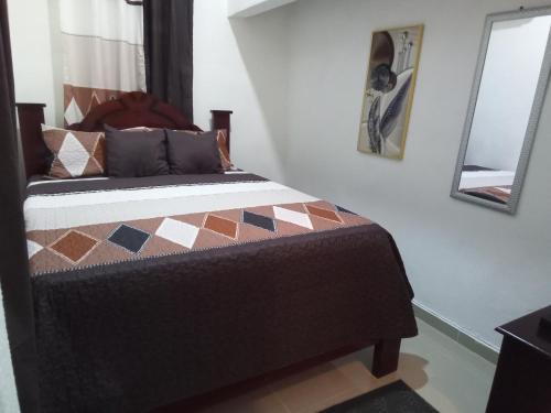 Postel nebo postele na pokoji v ubytování Hostal María Fernanda