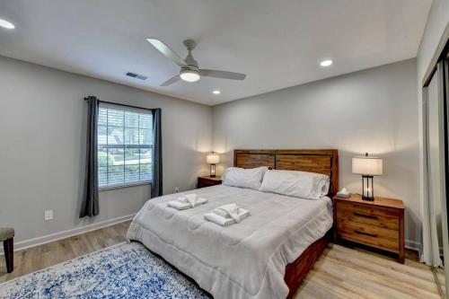 a bedroom with a large bed and a window at Walk to Avalon or Downtown 3 in Alpharetta