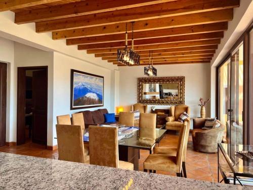 a living room with a table and a couch at Lovely 3BD 4BA APT Pool Gym Parking in San Miguel de Allende