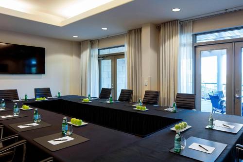 a conference room with long tables and chairs at Delta Hotels by Marriott Guelph Conference Centre in Guelph