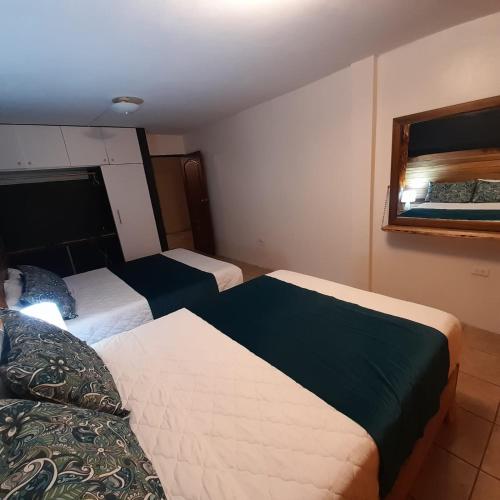Postel nebo postele na pokoji v ubytování Casa Verde Descanso 2