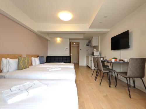 Postel nebo postele na pokoji v ubytování ESLEAD HOTEL Namba South Ⅰ