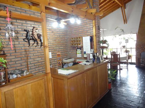 a bar with a horse on a brick wall at Hostería Lida in Merlo