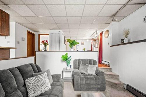 a living room with two chairs and a couch at Alaska Rafiki BnB-3 - Self check-in in Fairbanks