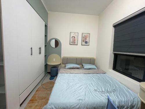Ένα ή περισσότερα κρεβάτια σε δωμάτιο στο Apartment Luxcity Cẩm Phả