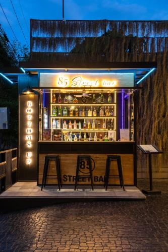 a store front of a bar at night at De Chai the Deco Chiang Mai - SHA Plus in Chiang Mai