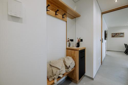a hallway of a house with white walls and a mirror at Ortsried-Hof in Laces