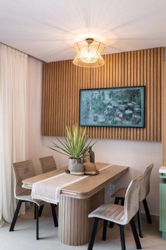 a dining room with a table and chairs at Contessa Suites in Lefkada Town