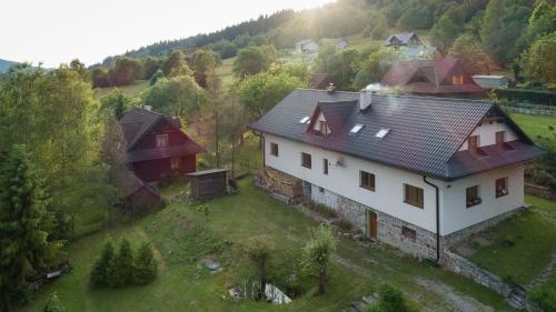 an aerial view of a house in a field at Ubytovanie Eva in Oščadnica