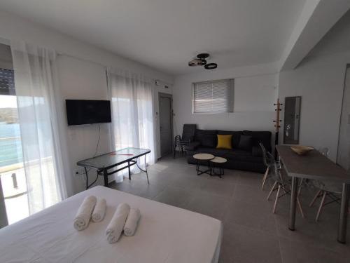 En eller flere senge i et værelse på Deluxe Σουίτα δίπλα στη Θάλασσα MFD LUXURY APARTMENTS