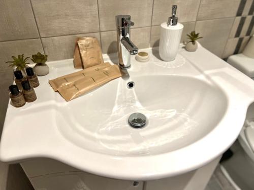 a white sink with a faucet in a bathroom at Irene' s Place in Olympia