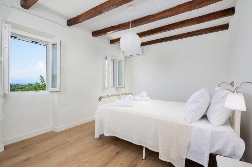 Ένα ή περισσότερα κρεβάτια σε δωμάτιο στο Casa Jinjola