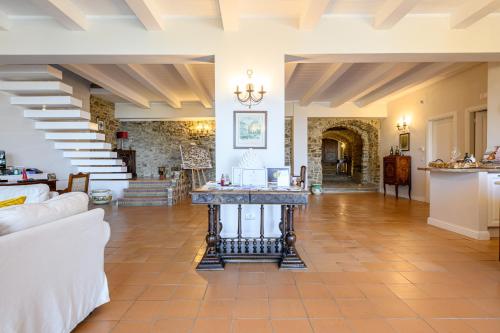 a large living room with a table in the middle at Palazzo Gargano in Prignano Cilento