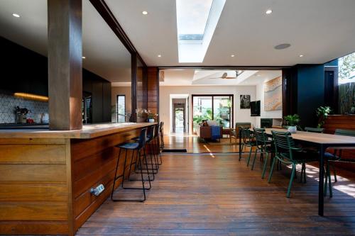 a bar in a restaurant with tables and chairs at Villa Catherine - 3BR Lilyfield in Sydney